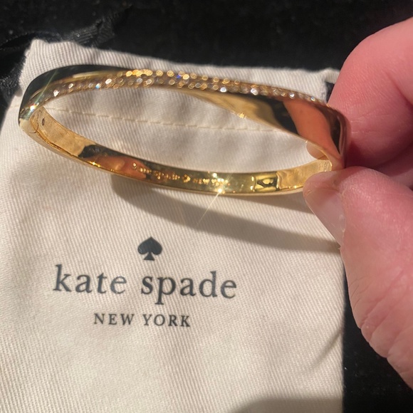KATE SPADE gold bracelet with diamond detail on curve of band. Opens with clasp - Picture 1 of 4